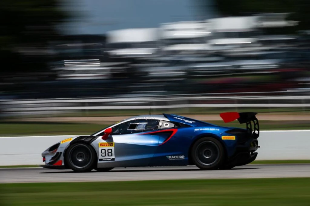 A McLaren Artura Trophy race car panning at speed